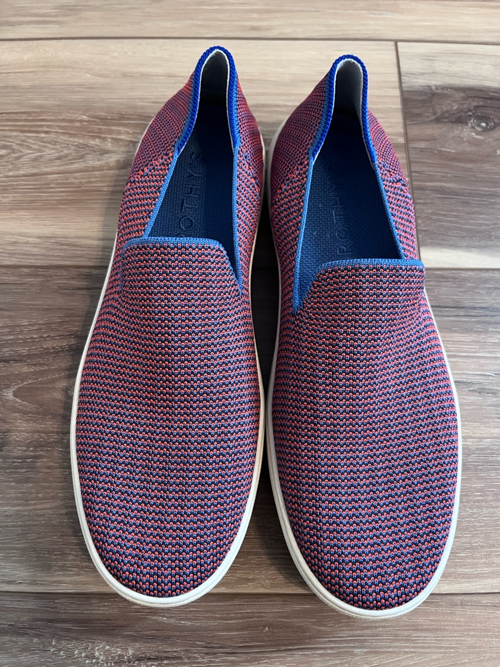 Rothy’s tangerine triple stitch sneakers